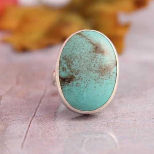 Large oval turquoise ring.