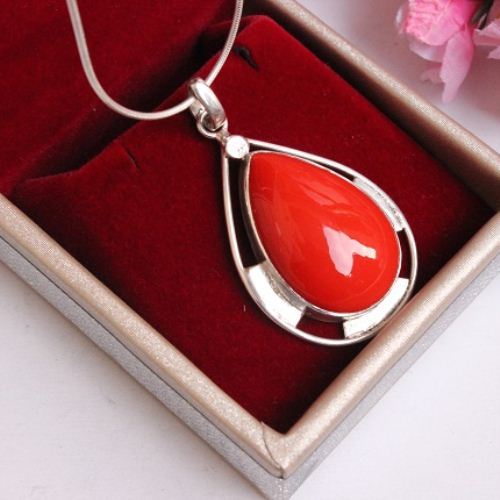 Artisan red coral stone silver pendant